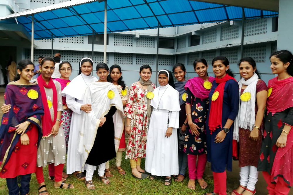 Nursing students come to support Catholic nuns in a Sept. 15 prayer program at the Pastoral Centre of Dwaraka parish in the Mananthavady Diocese, Kerala, India. (Saji Thomas)