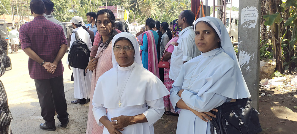 Srs. Jeo Mary (right) and Baptista Mary, both from the Franciscan Sisters of the Immaculate Heart of Mary, traveled from their convent in Kollam, India, 40 miles north of Vizhinjam, to protest the seaport. (GSR photo/Thomas Scaria)