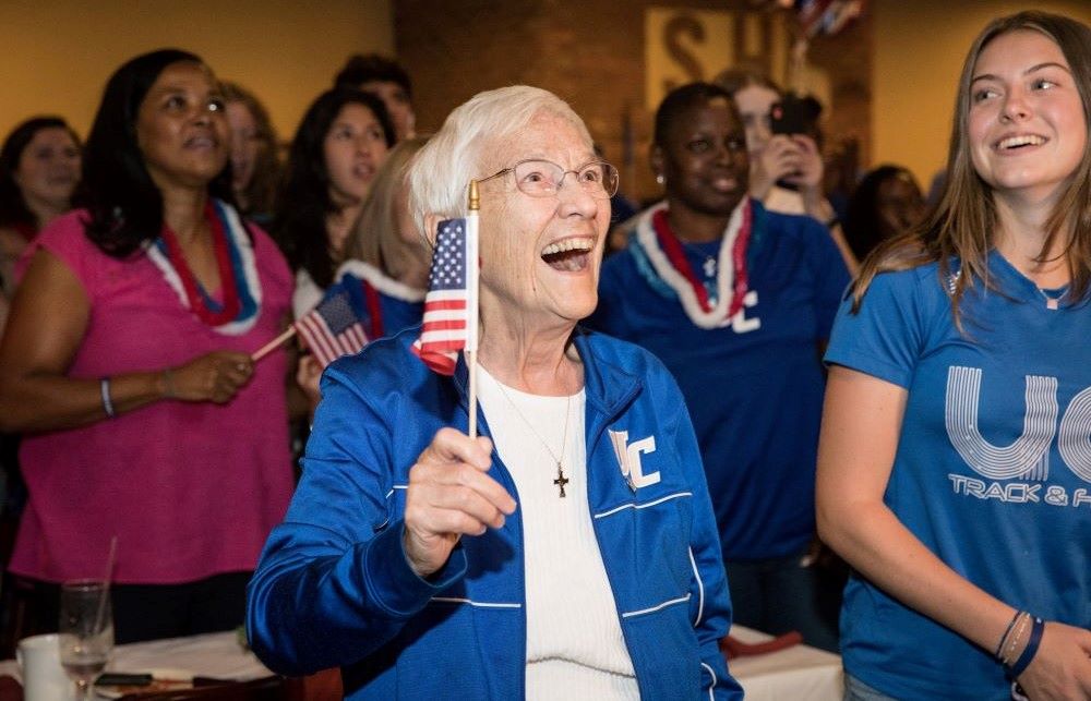 Mercy Sr. Percylee Hart cheers on Union Catholic Regional High School alumna Sydney McLaughlin on Aug. 3 as she competes in the 2020 Olympics. McLaughlin won a gold medal in the women's 400-meter hurdles event that day. (Courtesy of Jim Lambert)