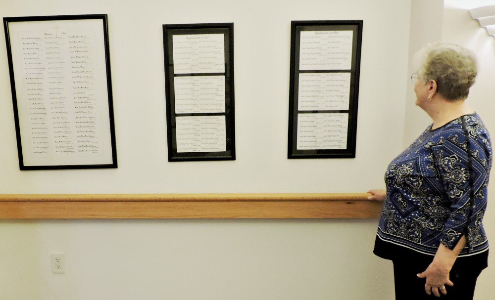 Sr. Marie Michele Donnelly surveys the names of sisters memorialized outside the chapel at the Convent of Mercy in Merion, Pennsylvania. (Elizabeth Eisenstadt Evans)