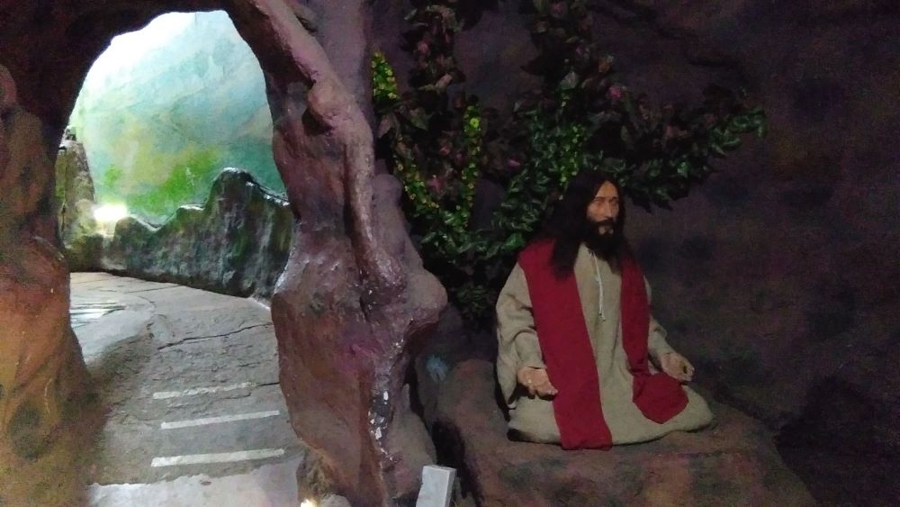 A statue of Jesus, wearing traditional Indian clothes, in prayer in "A Pilgrimage of the Heart" at the Basilica of Bom Jesus in Old Goa, western India. (Lissy Maruthanakuzhy)