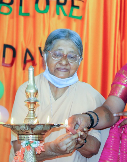 Sr. Adele Korah lights a lamp at the 2021 International Women's Day celebrations held in Bengaluru, India, for the families and relatives of prisoners. (Courtesy of Adele Korah)