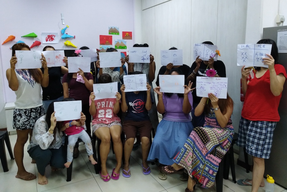 International women and children at Good Shepherd Centre in Singapore pose together before the pandemic began. (Provided photo)