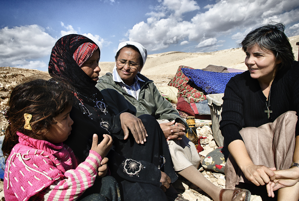 Comboni Sr. Alicia Vacas Moro, right, with Sr. Azezet Habtezghi, center, and a Bedouin family in the desert of Juda on the West Bank after the family's home had been demolished by Israel Defense Forces in 2013 (Courtesy of Sr. Alicia Vacas Moro) Comboni Sr. Alicia Vacas Moro, right, with Sr. Azezet Habtezghi, center, and a Bedouin family in the desert of Juda on the West Bank after the family's home had been demolished by Israel Defense Forces in 2013 (Courtesy of Sr. Alicia Vacas Moro)