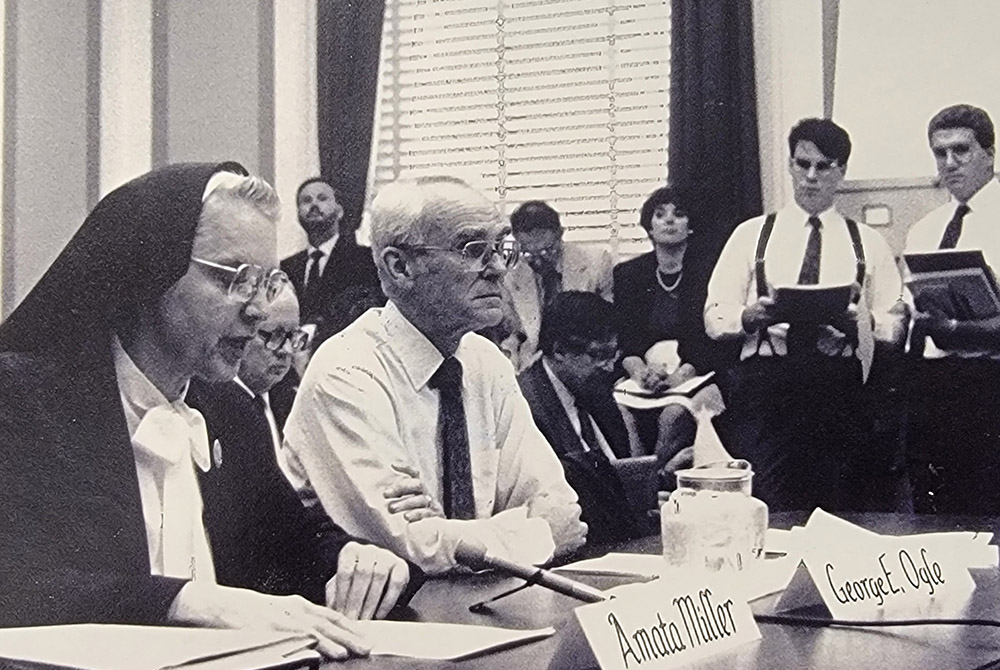 Amata Miller congressional testimony Sr. Amata Miller and George Ogle testify June 27, 1990, before the U.S. House Committee on Banking, Finance and Urban Affairs regarding the Economic Adjustment, Diversification, Conversion and Stabilization Act of 1990. (Courtesy of IHM Sisters)