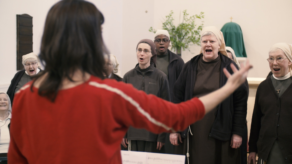 The Poor Clares of Arundel sing during a recording session for their CD, "Light for the World." Husband-and-wife team Juliette Pochin, pictured facing away, and James Morgan co-wrote all the new music on the CD, which was recorded before the rise of the C