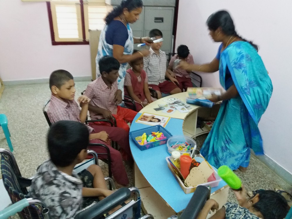 Teachers and students work in a classroom at Asha Deepam in Trichy, Tamil Nadu, southern India. (Philip Mathew)