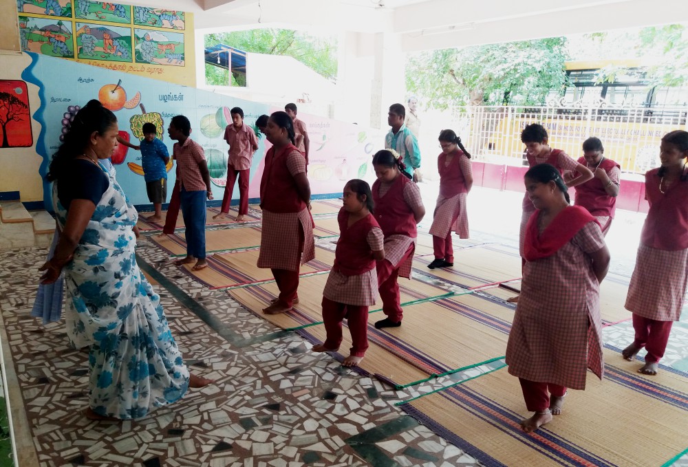 Students follow the yoga instructor at Asha Deepam in Trichy, Tamil Nadu, southern India. (Philip Mathew)