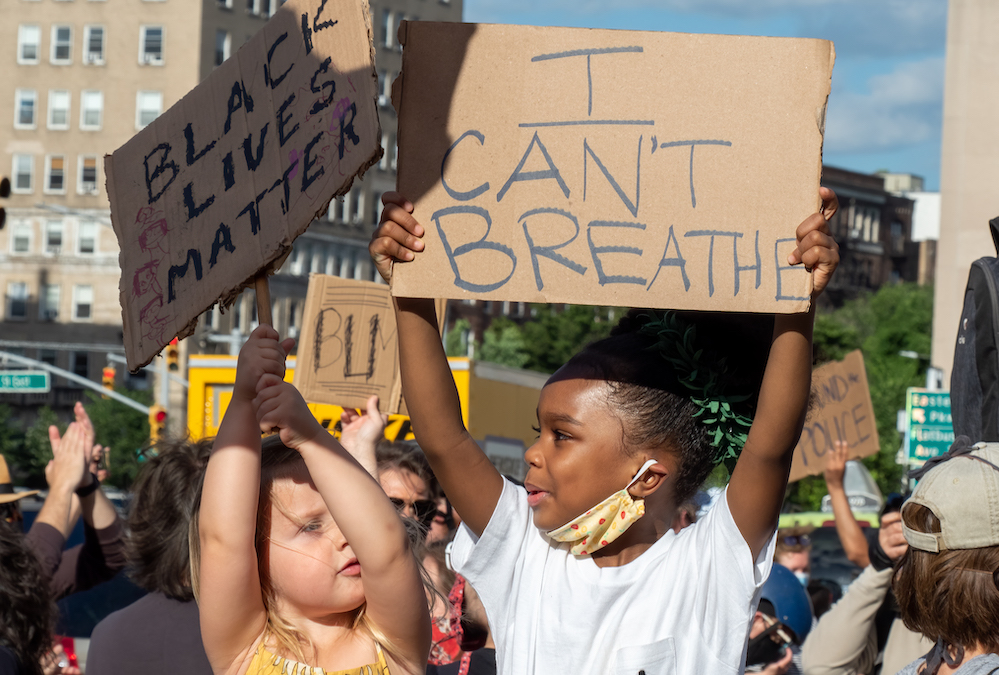 Children hold signs saying "Black Lives Matter" and "I Can't Breath" at a demonstration in Prospect Park, Brooklyn, New York, June 7. (Wikimedia Commons/Rhododendrites)