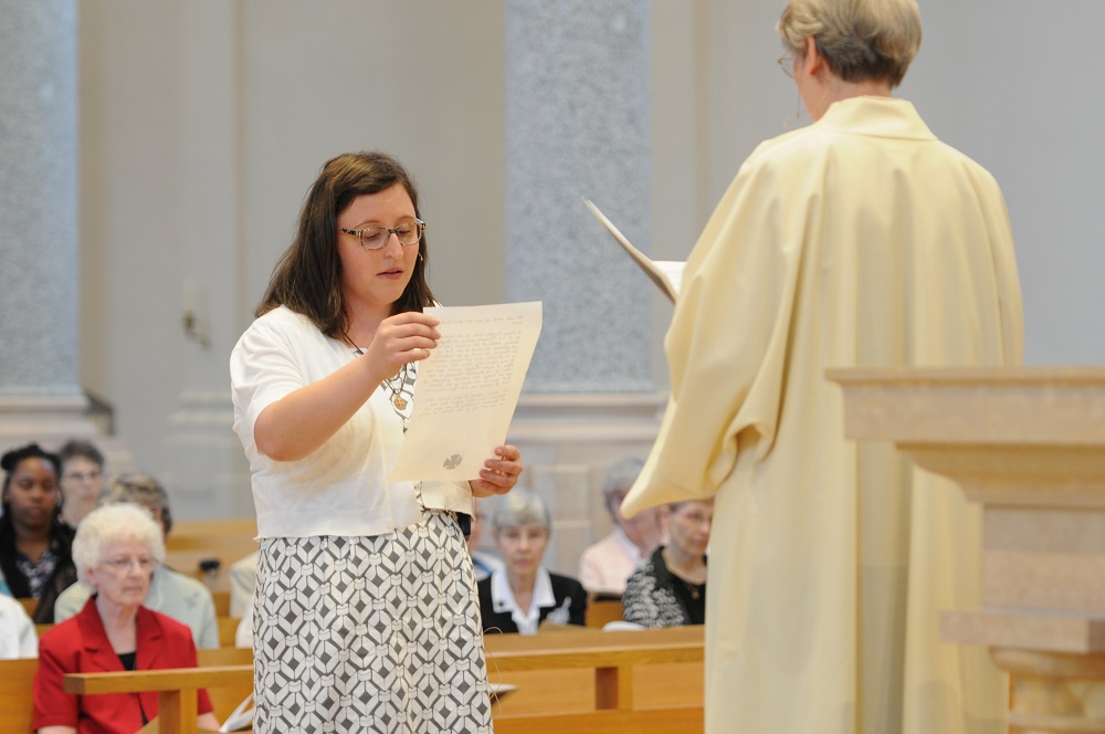 Sr. Bridgette Powers reads her profession document on July 11, 2017, with Sr. Susan Rudolph, prioress of St. Benedict's Monastery. (Courtesy of Benedictine Sr. Nancy Bauer) 