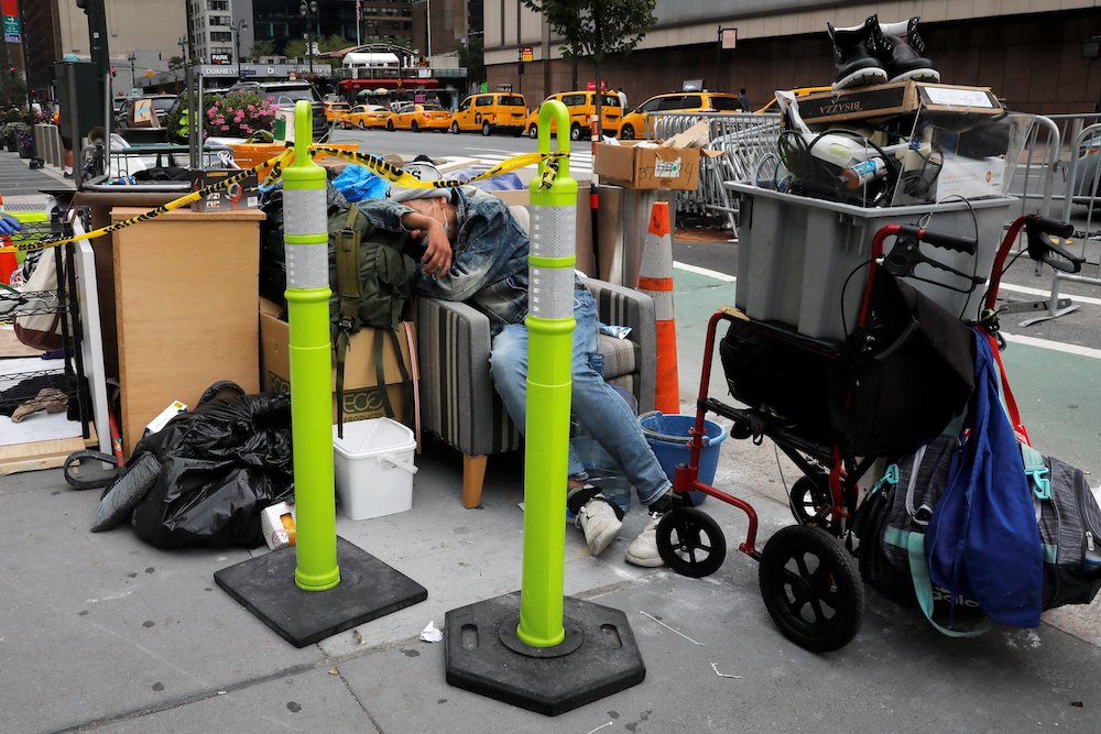 A homeless person in New York City sleeps among belongings Aug. 31. (CNS/Reuters/Mike Segar)