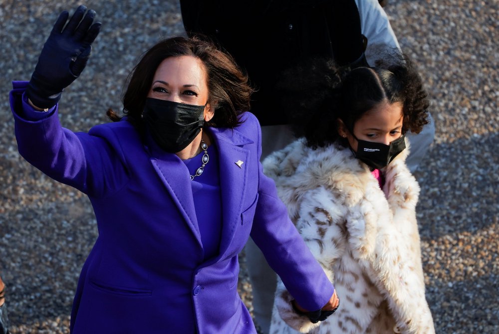 Vice President Kamala Harris walks with her great-niece Amara Ajagu to the White House in Washington Jan. 20, 2021, during the Inauguration Day parade. (CNS/Reuters/Andrew Kelly)