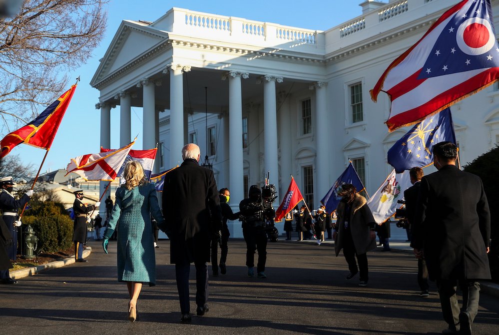 President Joe Biden and first lady Jill Biden walk to the White House in Washington Jan. 20, 2021. (CNS/Reuters/Tom Brenner)