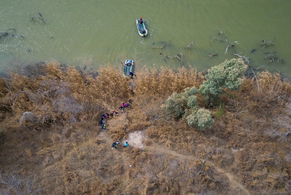 People are seen from above walking from rafts that had crossed the Rio Grande River toward Penitas, Texas, March 6, 2021. (CNS/ Reuters/Adrees Latif)