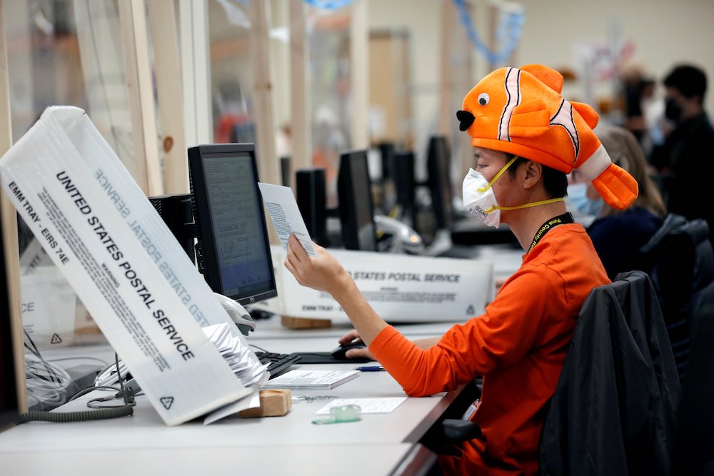 An employee in Tucson, Arizona, wears a Halloween costume Oct. 31 while processing early voting and absentee ballots ahead of the upcoming presidential election Nov. 3. (CNS/Reuters/Cheney Orr)