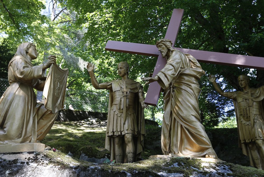 Veronica wipes the face of Jesus in this representation of the sixth Station of Cross at the Shrine of Our Lady of Lourdes in southwestern France. (CNS/Paul Haring)