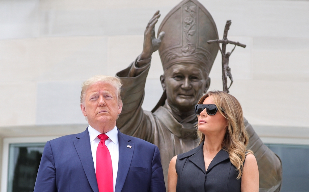 U.S. President Donald Trump and first lady Melania Trump pose outside the St. John Paul II National Shrine in Washington June 2, 2020, the 41st anniversary of beginning of pope's 1979 historic visit to Poland. (CNS/Reuters/Tom Brenner)