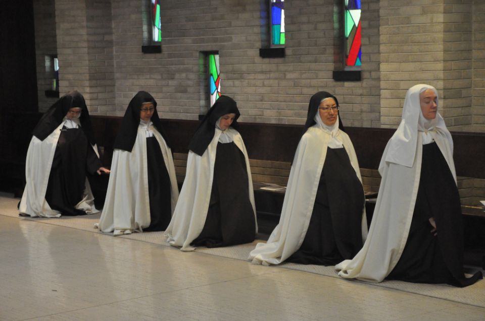 Discalced Carmelite Sisters Mary Grace Melchior, Marianna So, Marie Cecile Franer, Susanna Choi and Christine Rosencrans kneel at the Carmelite Monastery of St. Joseph in Terre Haute, Indiana. Discalced Carmelite Sisters Mary Grace Melchior, Marianna So, Marie Cecile Franer, Susanna Choi and Christine Rosencrans kneel at the Carmelite Monastery of St. Joseph in Terre Haute, Indiana.