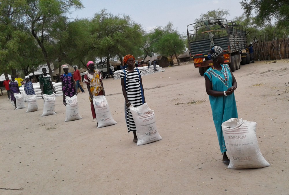 Participants in a U.S. Agency for International Development food security program practice social distancing while waiting to receive food rations at a food-for-assets distribution in Duk, South Sudan, on April 2. (Courtesy of Catholic Relief Services)