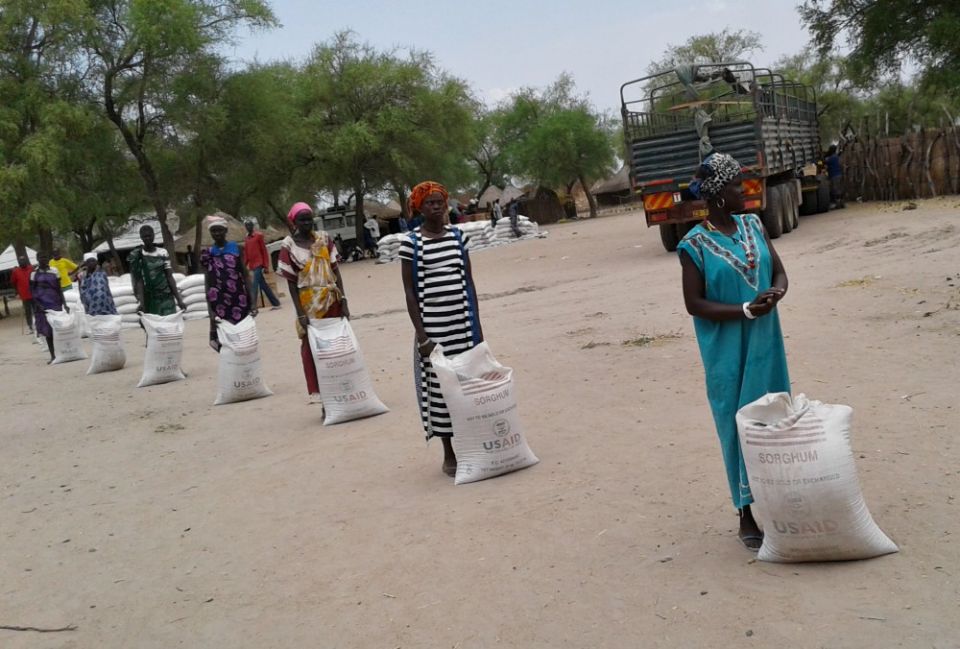 Participants in a U.S. Agency for International Development food security program practice social distancing while waiting to receive food rations in Duk, South Sudan, on April 2. (Courtesy of Catholic Relief Services / Gatluak Miak Deng)