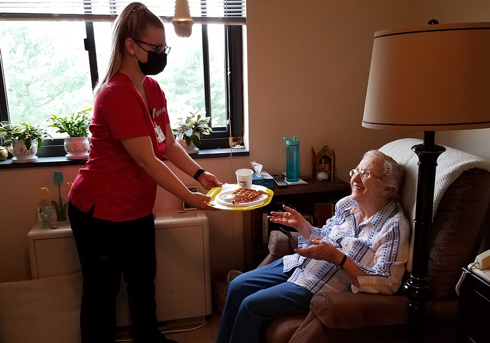 Caldwell University nursing student Elizabeth Ann McChesney visits with Dominican Sr. Rita Calabrese at the St. Catherine of Siena Convent in Caldwell, New Jersey. (Courtesy of Caldwell University)