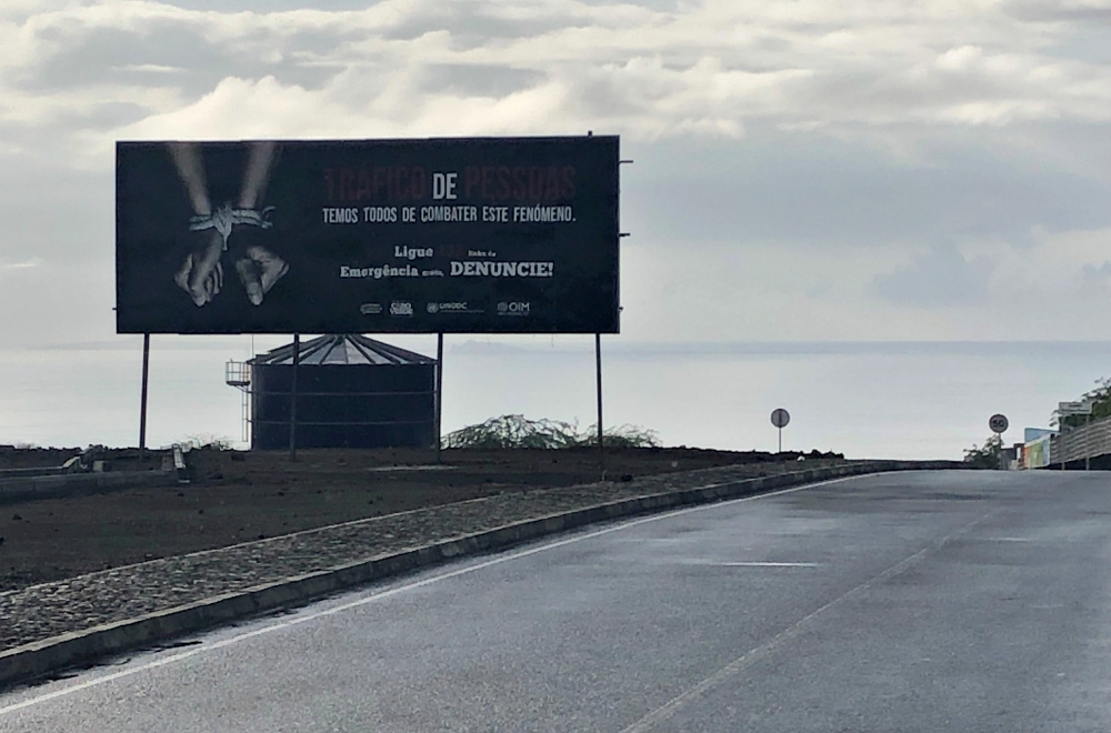 An anti-trafficking billboard along a major corridor in Praia, Cape Verde's capital, is part of a partnership between Kreditá na bo and the Cape Verdean Ministry of Justice. (Dana Wachter)