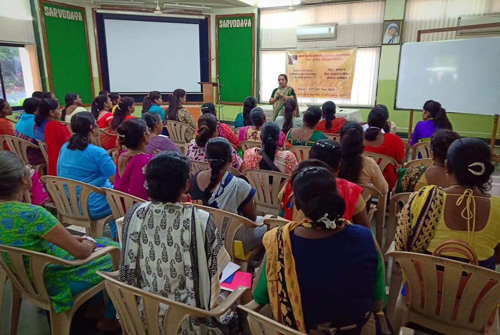 Sr. Christin Mary, a member of the Missionary Sisters of the Immaculate Heart of Mary and a coordinator of the National Domestic Workers' Movement, speaks to a class for a group of domestic workers and their supporters in the western Indian city of Mumbai