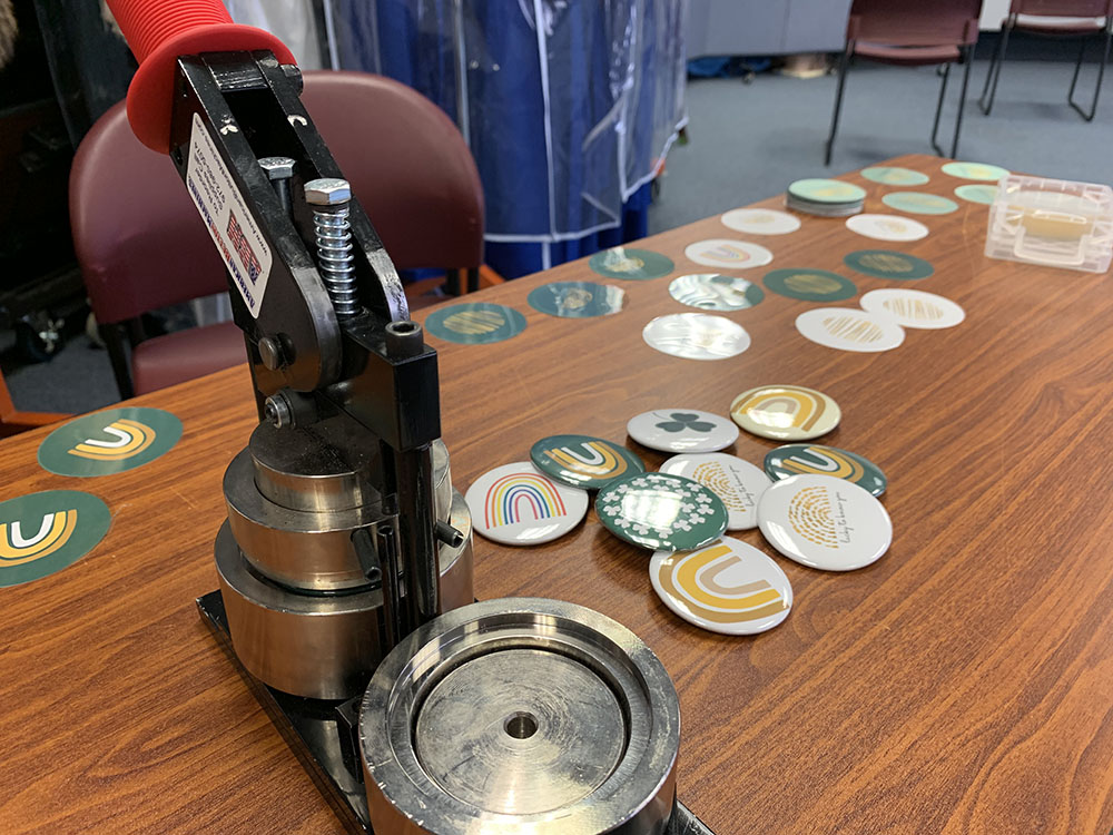 One of the ways we celebrate our students is by making holiday celebrations extra special. This year, I designed and created buttons in honor of St. Patrick's Day for staff and students. (Maddie Thompson)