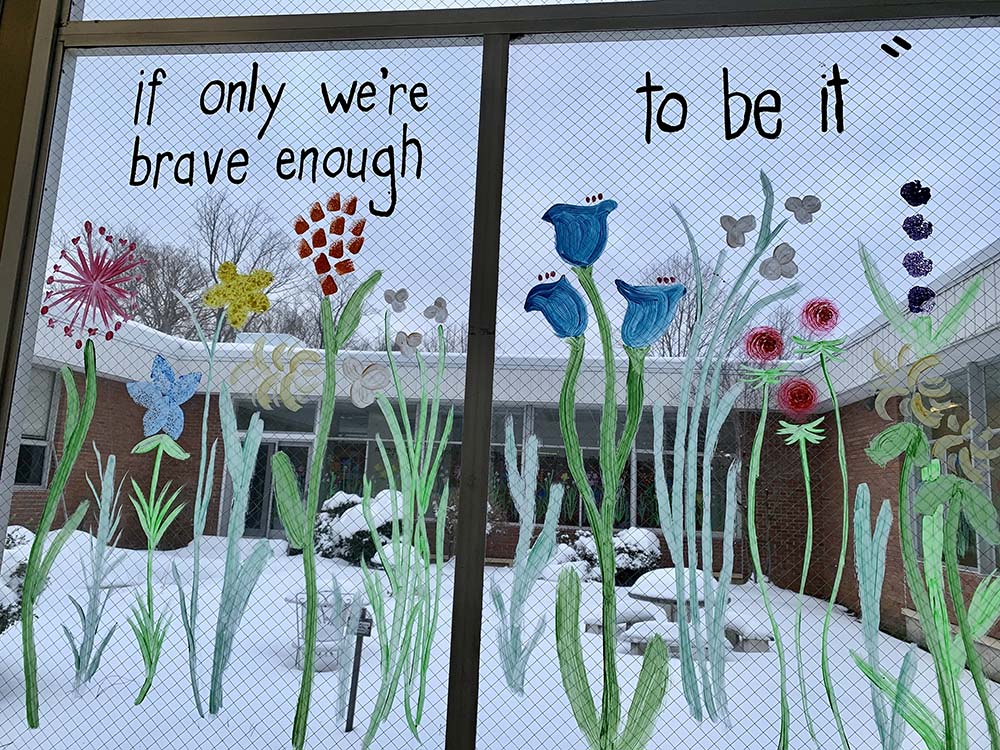 A quote from Amanda Gorman's poem "The Hill We Climb" on windows at Collier High School (Maddie Thompson) A quote from Amanda Gorman's poem "The Hill We Climb" on windows at Collier High School (Maddie Thompson)