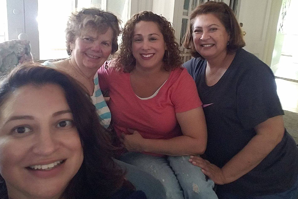 Sr. Darlene Kawulok of the Sisters of St. Joseph of Carondelet, Los Angeles Province, (second from left) takes a picture with women living at Medaille House in July 2019. Medaille House, founded in 2013 by the St. Joseph sisters, started offering virtual 