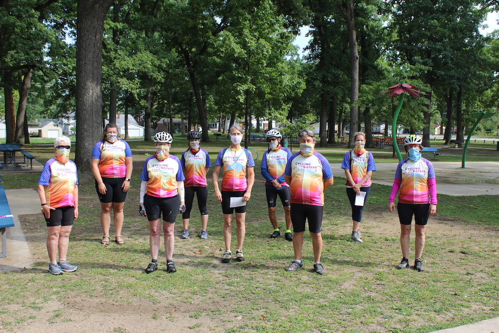 The nine Cycling with Sisters riders pose for a photo at the end of their 60-mile ride from Chesterton, Indiana, to South Bend on Sept. 11. (Nick Schafer)