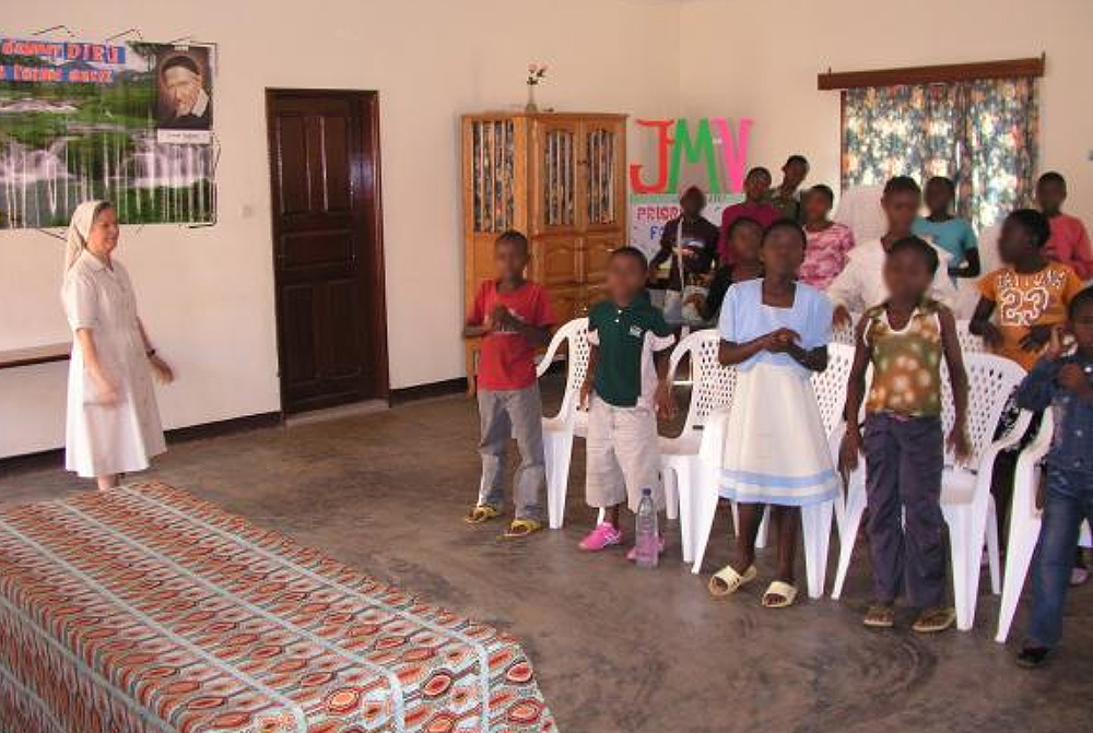 A Sister of St. Vincent de Paul of Lendelede oversees a group of children in daily care at the St. Vincent de Paul Children Rehabilitation Center in Musanze, Rwanda. This photo has been edited to protect the children's identities. (Aimable Twahirwa)