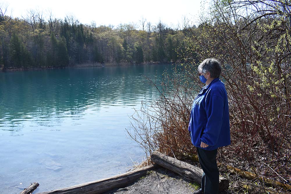 Sr. Caryn Crook, vocation director for the Sisters of St. Francis of the Neumann Communities, enjoys the view of Green Lake while members of the House of Discernment community visited Syracuse, New York, in late April. (Julie A. Ferraro)