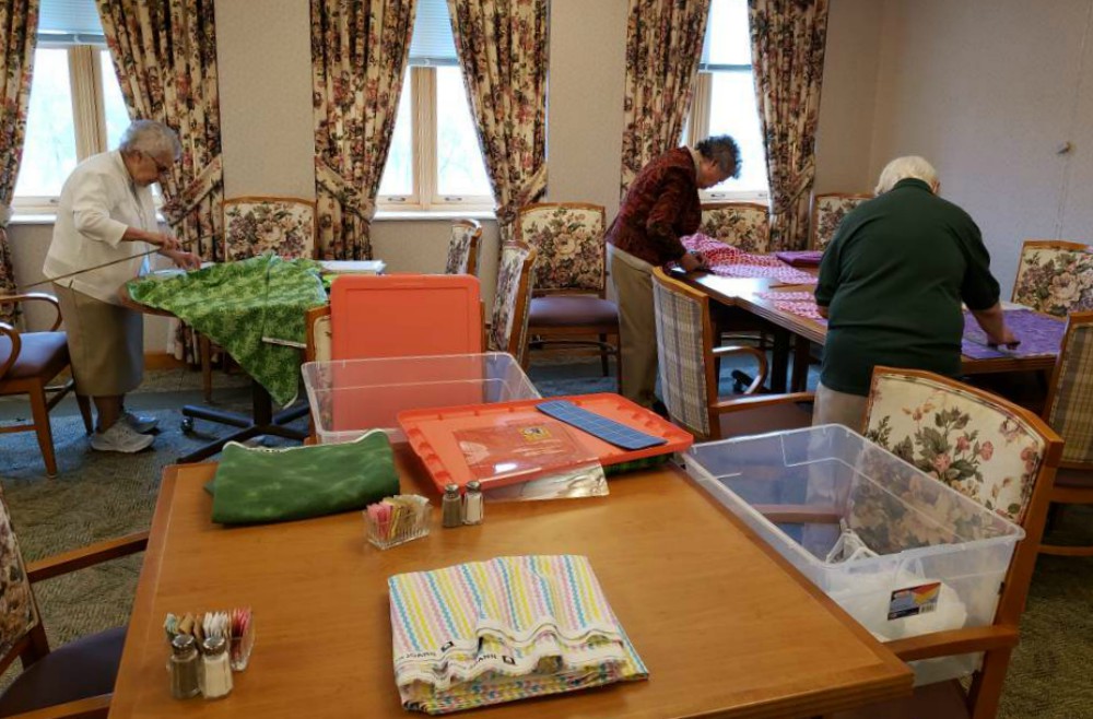 From left: Sr. Mary Ann Fatula, Sr. Catherine Malya Chen and Sr. Mary Jo Knittel of the Dominicans of Peace make masks at the community's motherhouse in Columbus, Ohio. (Courtesy of the Dominicans of Peace / Jean Sylvester)