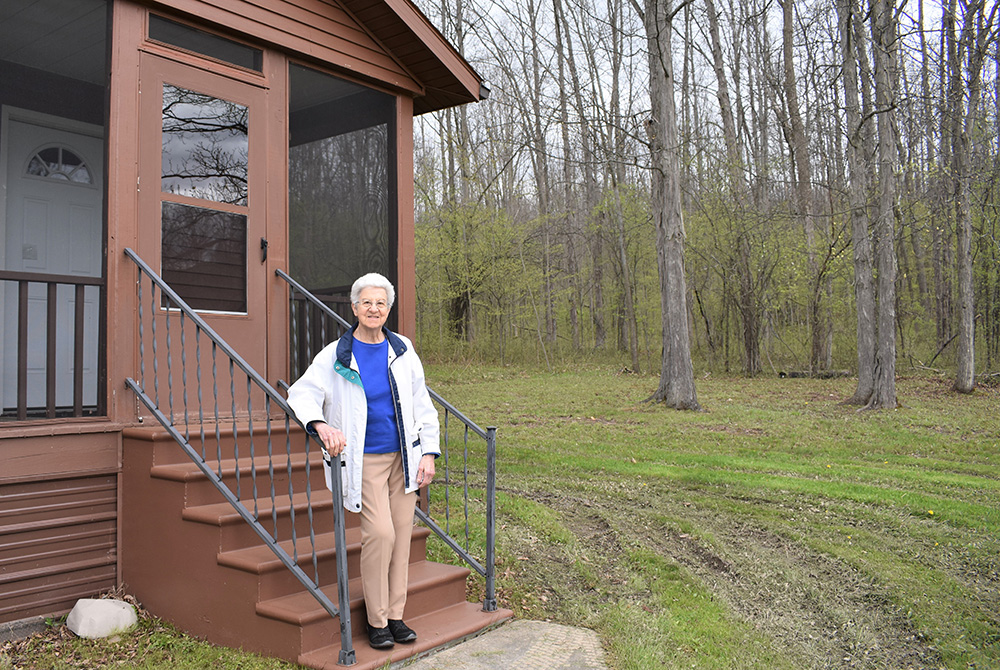 Mercy Sr. Donna Marie Paolini on the hermitage steps at the Center for Solitude in Belmont, New York (Courtesy of the Sisters of Mercy)