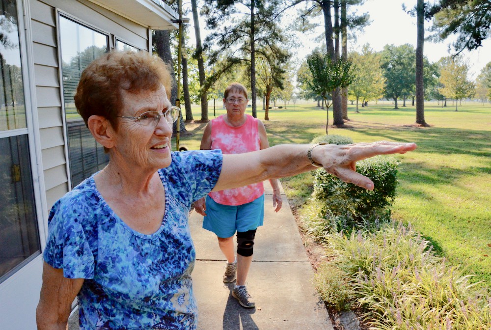 Dwelling Place Sr. Clare Van Lent shows the grounds of the community's retreat center in Brooksville, Mississippi, in September 2019. Behind her is Sr. Mary Horrell. (GSR photo / Dan Stockman)