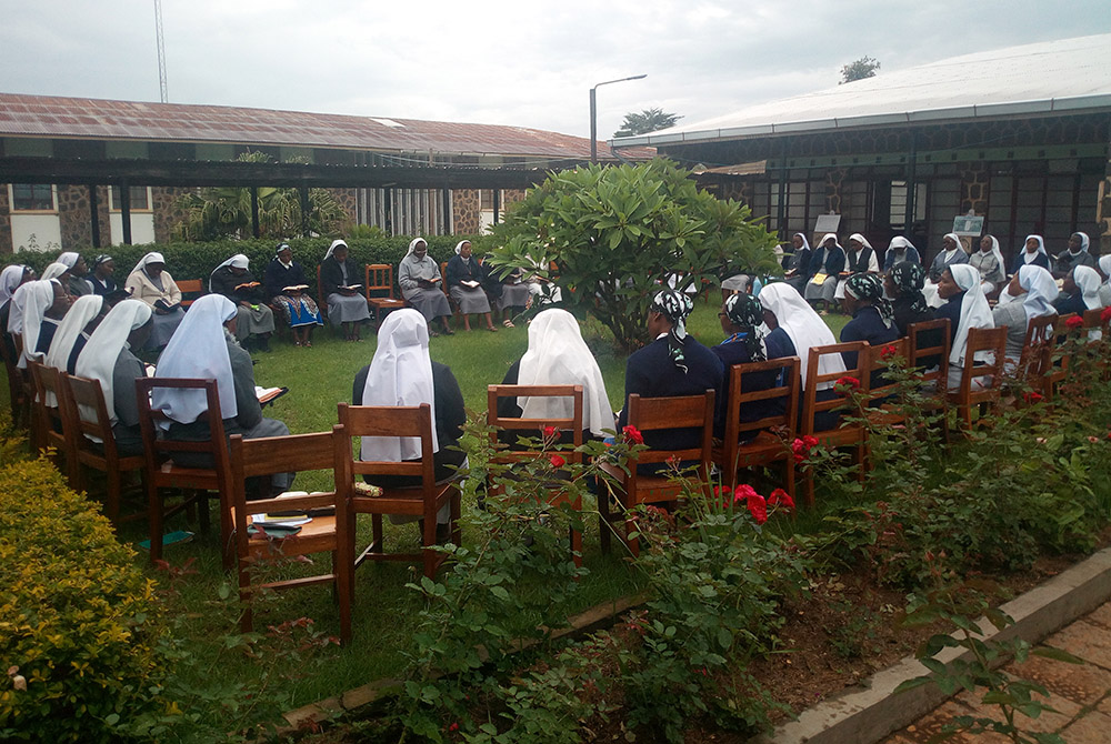 Members of the Tertiary Sisters of St. Francis in Shisong, Cameroon, meet during a previous Earth Day commemoration. The congregation's many environmental projects include community gardens that serve as a demonstration site to boost soil fertility. The g