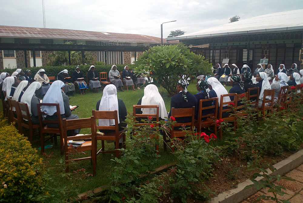 Members of the Tertiary Sisters of St. Francis in Shisong, Cameroon, meet during a previous Earth Day commemoration. The congregation's many environmental projects include community gardens that serve as a demonstration site to boost soil fertility. The g Members of the Tertiary Sisters of St. Francis in Shisong, Cameroon, meet during a previous Earth Day commemoration. The congregation's many environmental projects include community gardens that serve as a demonstration site to boost soil fertility. The g
