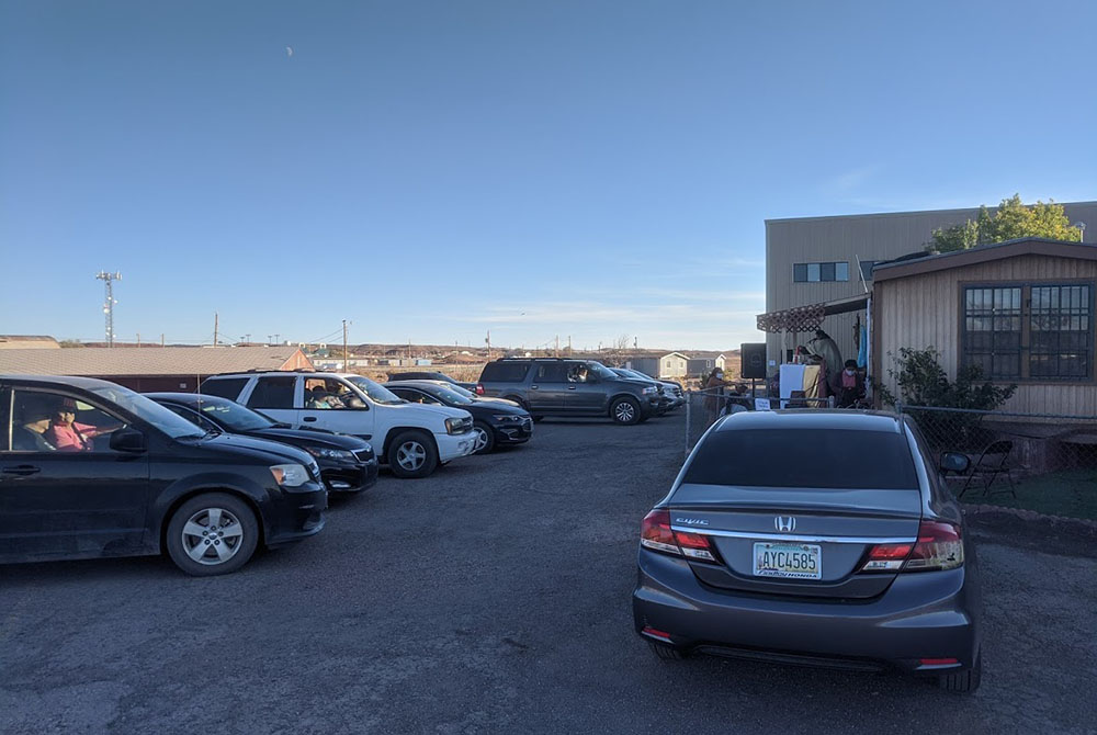 Our Lady of Fatima parish holds Sunday Mass on Friday at 5 p.m. because of the weekend curfew. The Mass is celebrated in the church’s parking lot so people can practice social distancing. Some have driven more than 40 miles just to be able to worship with