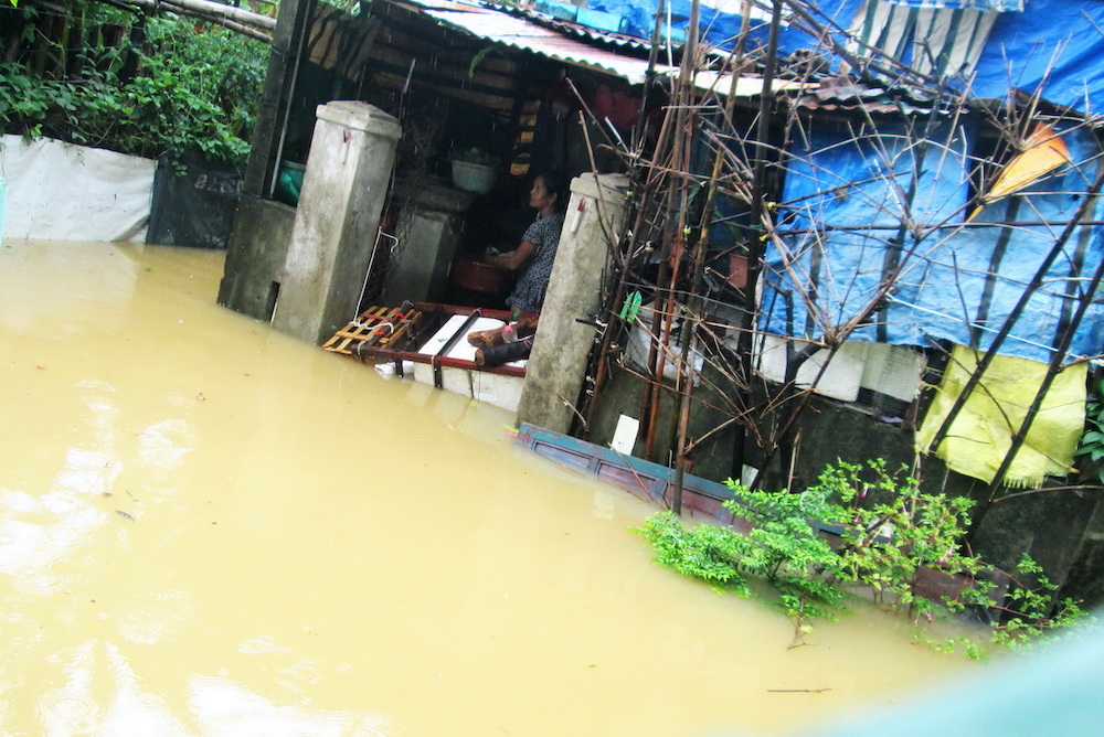 Tran Thi Hiep, a Hue resident, had her house flooded. (Joachim Pham)