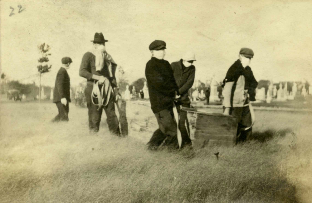 Masked seminarians bury 1918 flu epidemic victims in Philadelphia. (Catholic Historical Research Center, Archdiocese of Philadelphia/Louis Meyer)