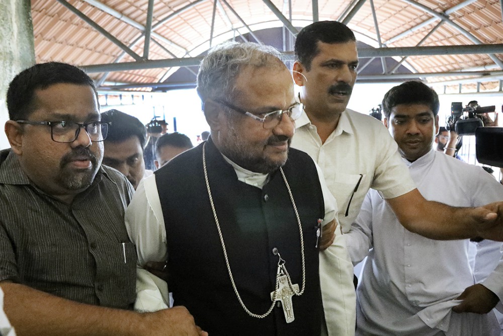 Bishop Franco Mulakkal of Jalandhar, center, enters the portico of the Additional District and Sessions Court in Kottayam, Kerala, Nov. 30, 2019, to stand trial in the rape of a nun. (M.A. Salam)