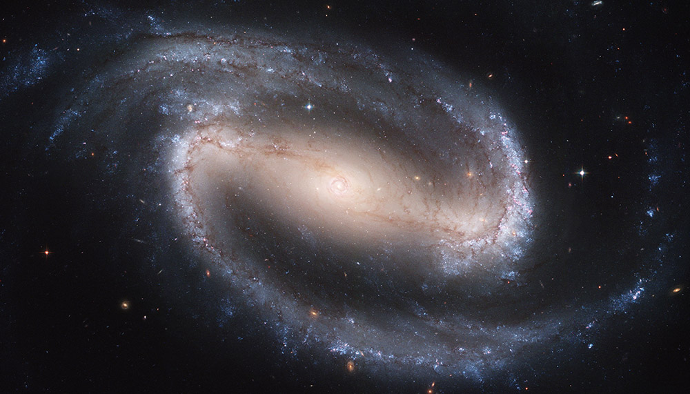 A barred spiral galaxy, seen through the Hubble Space Telescope (NASA)