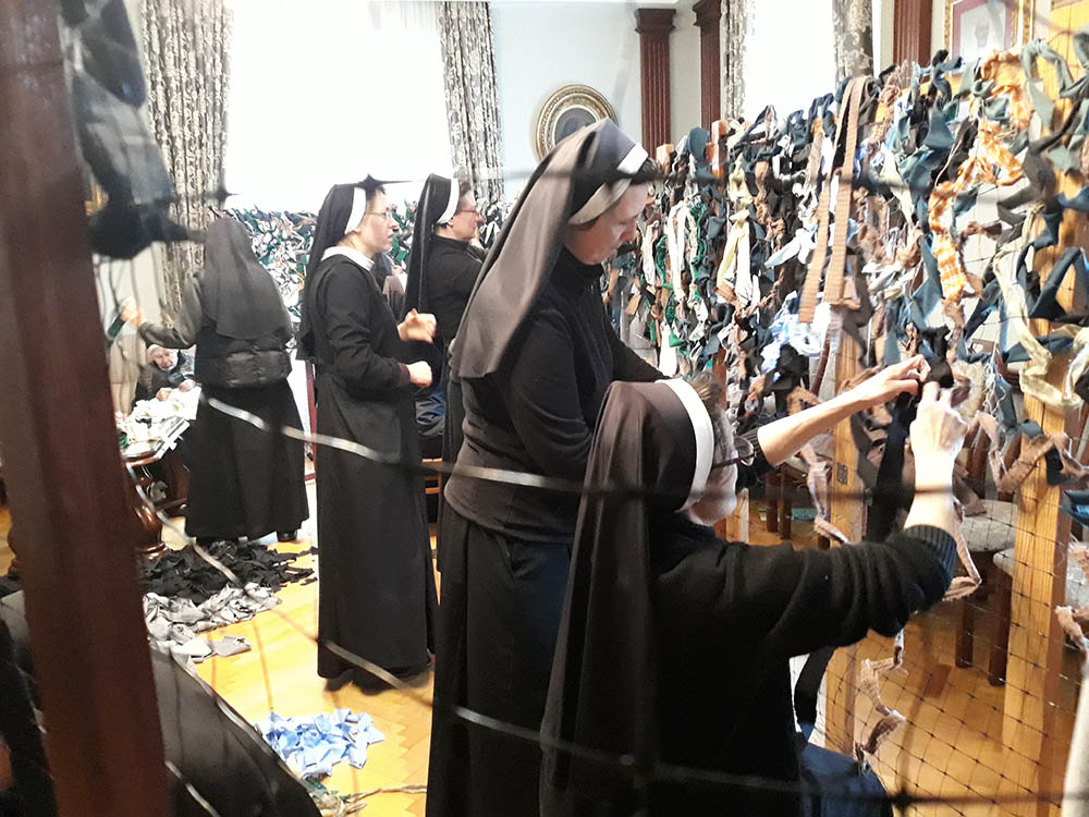 Basilian Sisters in Ukraine weave camouflage nets. (Courtesy of the Basilian Sisters)