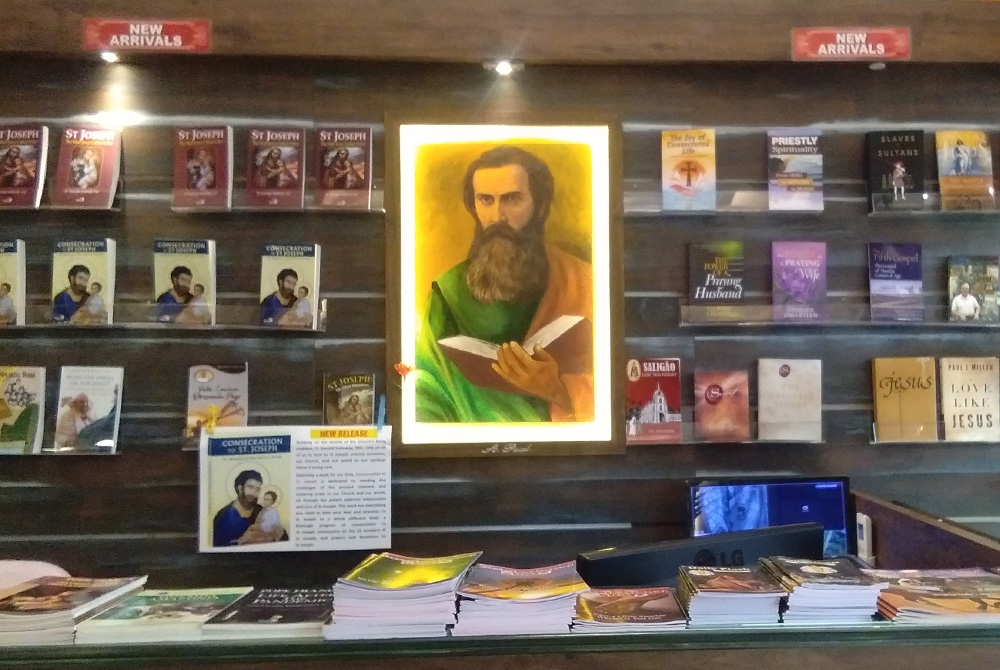 A painting of St. Paul hangs behind the counter at the Pauline Book Centre in Panaji, Goa, in India. The feast day of St. Paul is June 29. (Courtesy of Lissy Maruthanakuzhy)