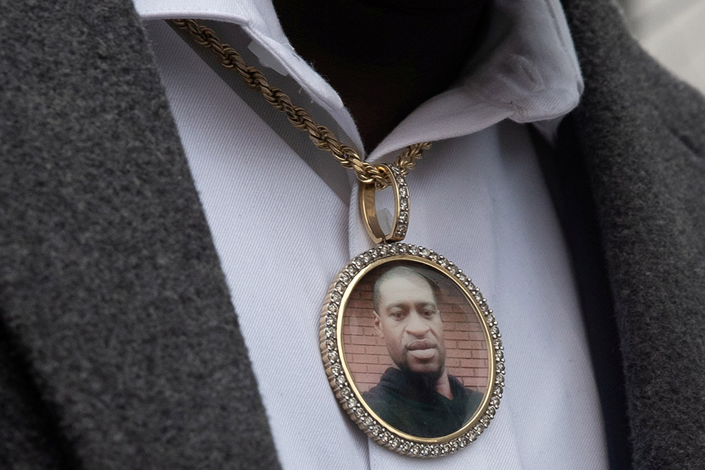 An image of George Floyd hangs from a necklace worn by a family member after an April 19 prayer session outside the Hennepin County Government Center in Minneapolis. (CNS/Reuters/Adrees Latif)
