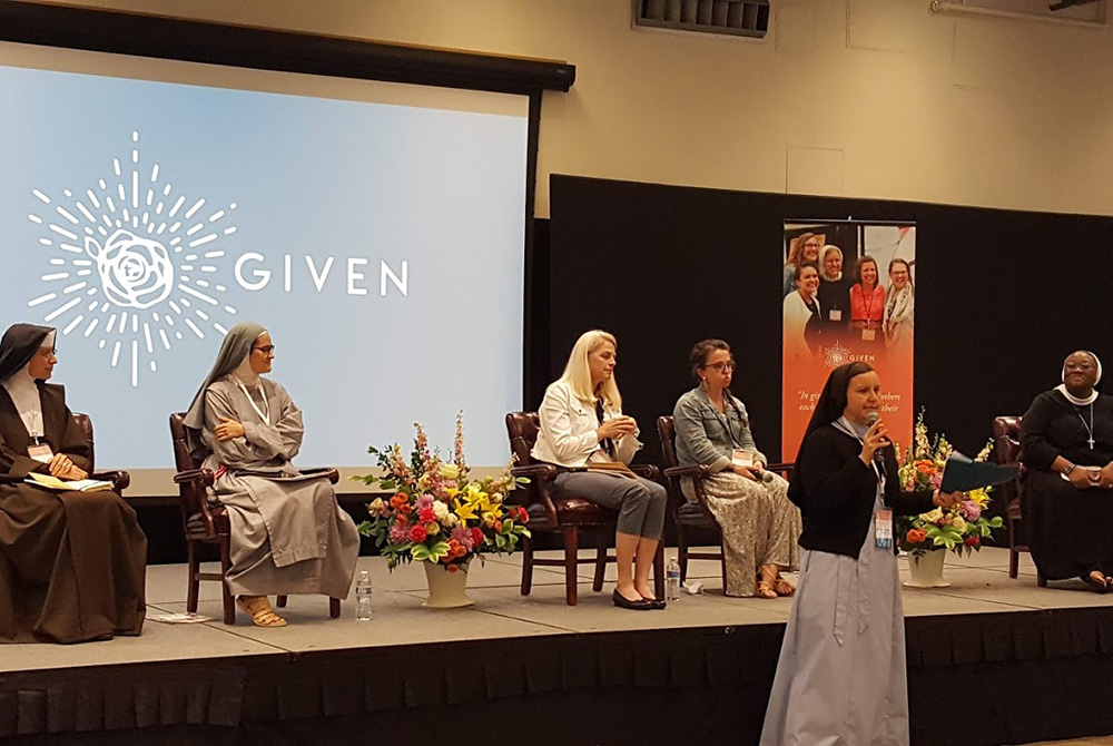 Sr. Maria Juan Anderson of the Religious Sisters of Mercy of Alma, Michigan, introduces the panelists at a session about consecrated life June 12 at the Given forum at the Catholic University of America in Washington, D.C. The panelists are, from left, Sr