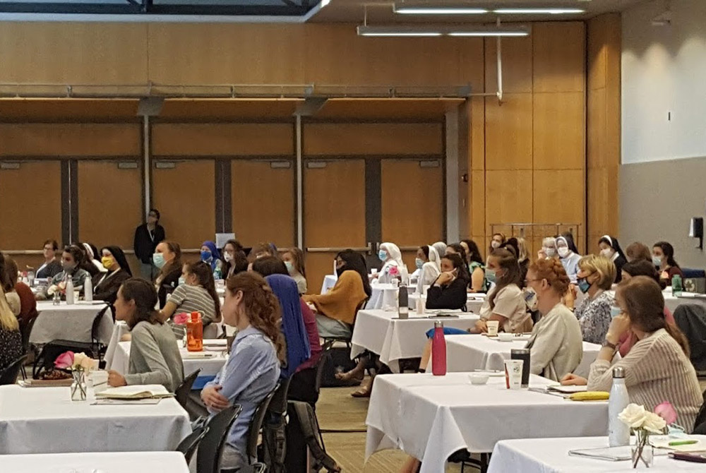 Attendees of the Given Catholic Young Women's Leadership Forum, held June 9-13 at Catholic University of America, took precautions against COVID-19, including practicing social distancing, eating meals outside when possible and wearing masks inside. (GSR 