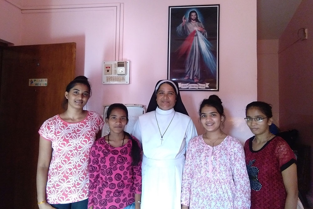 Holy Family of Nazareth Sr. Lourenca Marques, center, with students, from left, Savitri Harijan, Aswini Gaunder, Sangeeta Harijan and Pinky Gaunder at Asha Sadan in Baina in Goa, western India (Lissy Maruthanakuzhy) Holy Family of Nazareth Sr. Lourenca Marques, center, with students, from left, Savitri Harijan, Aswini Gaunder, Sangeeta Harijan and Pinky Gaunder at Asha Sadan in Baina in Goa, western India (Lissy Maruthanakuzhy)
