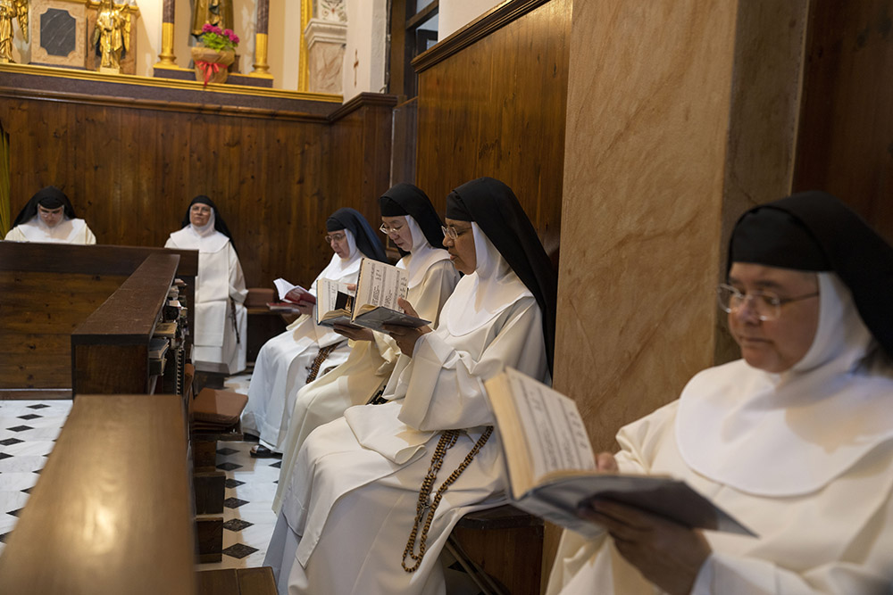 From left to right, Sister María Guadalupe, Sister María Esclava, Sister María de Jesús, Sister María de la Trinidad, Sister María Fátima and Sister Amparo de María pray in the Catholic Monastery of St. Catherine on the Greek island of Santorini June 14.
